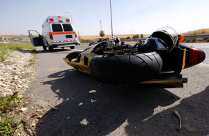A motorcycle accident and a paramedic van on the street. Another reason you need a Sacramento motorcycle accident attorney